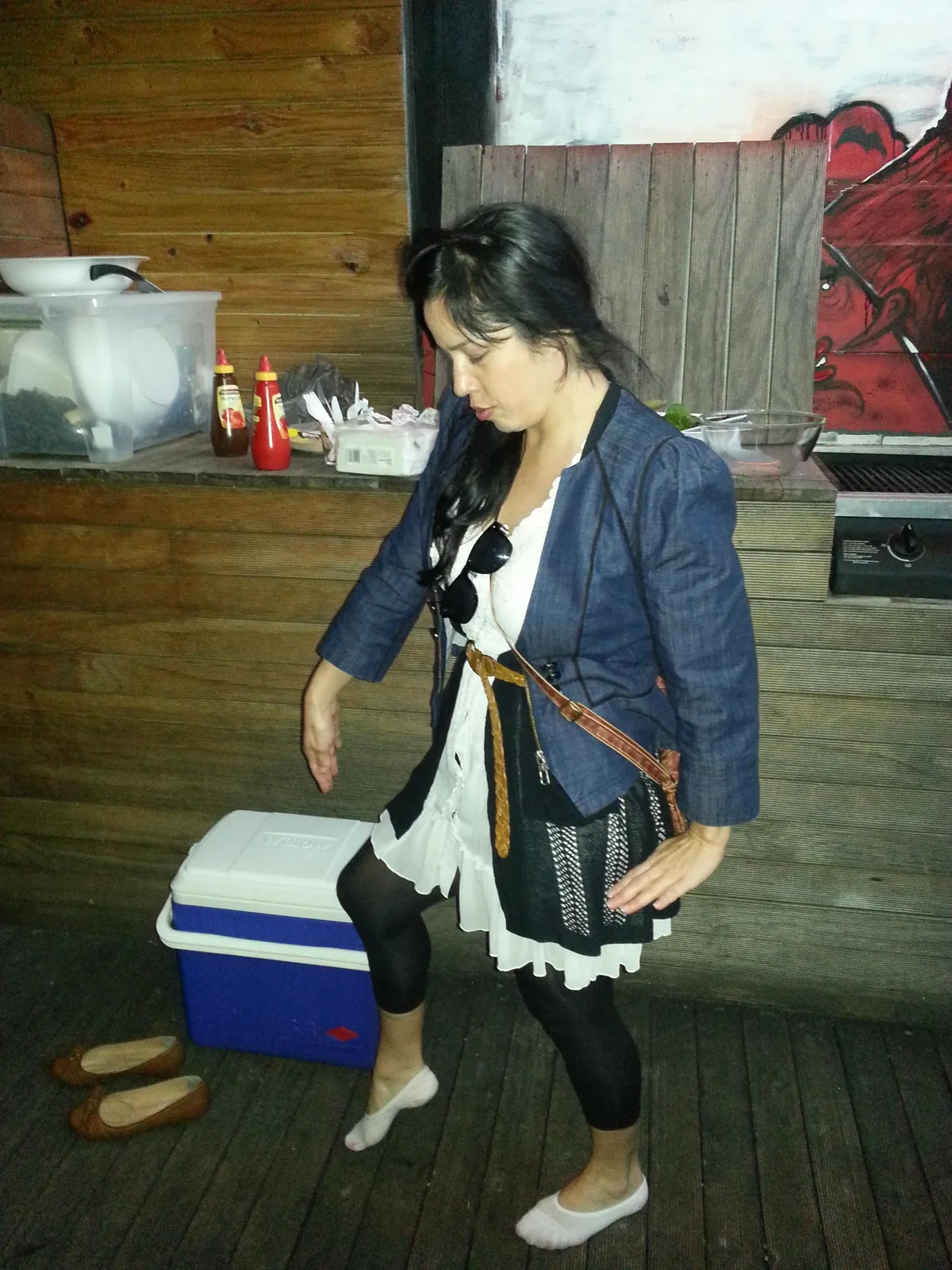 Someone carrying a cooler past the bar at Ching-a-Lings Sunday Sessions