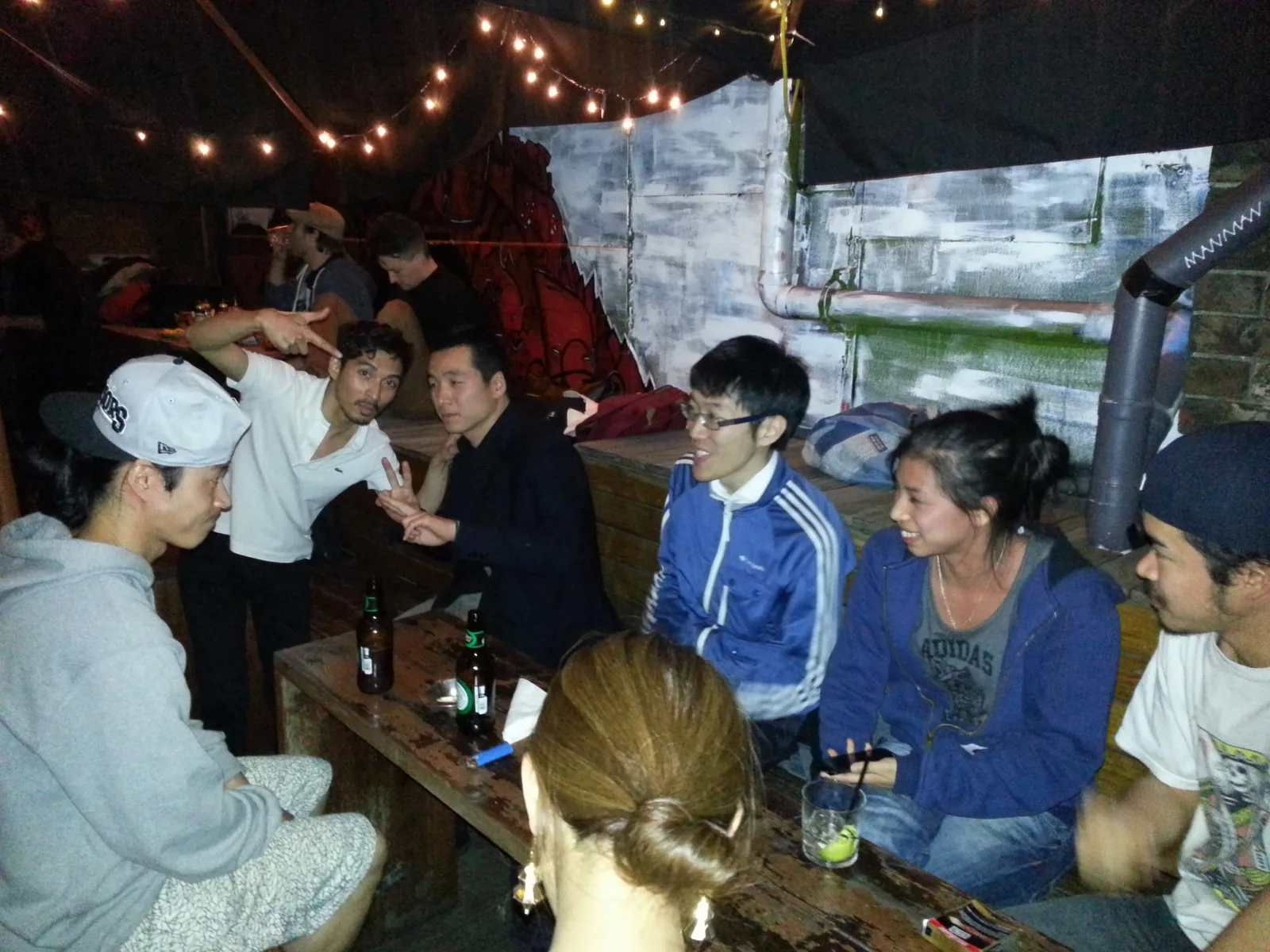 People sitting along the bench seating at Ching-a-Lings Sunday Sessions