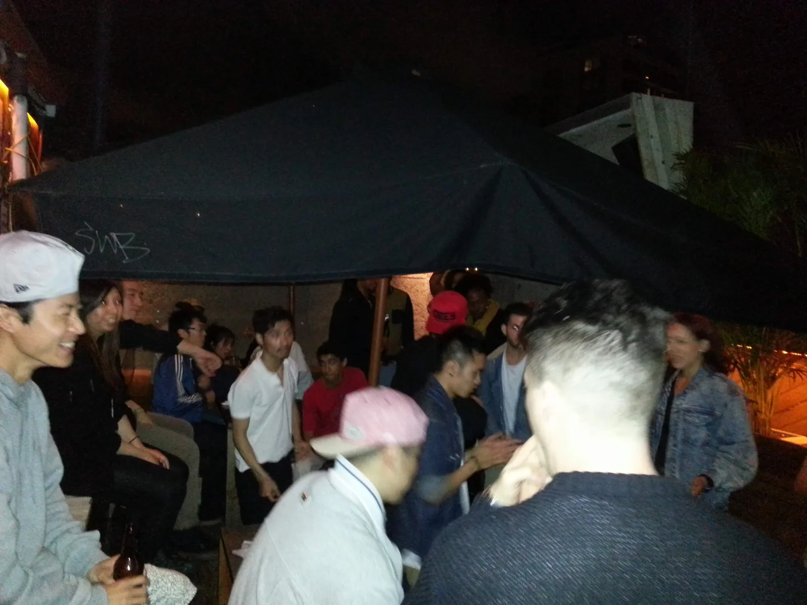 Crowd under the marquee in the courtyard at Ching-a-Lings after dark