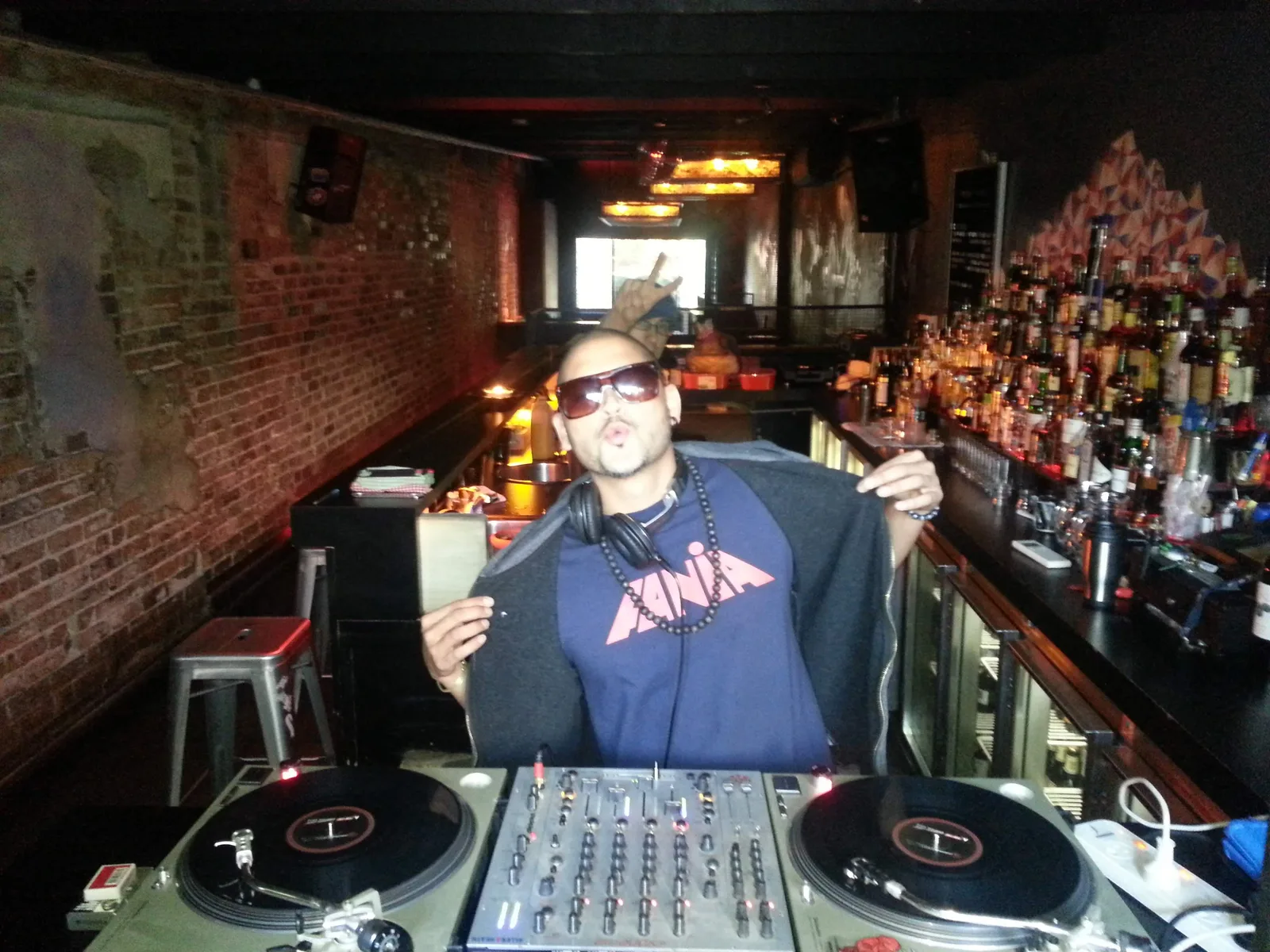 DJ at the turntables in the bar at Ching-a-Lings Sunday Sessions