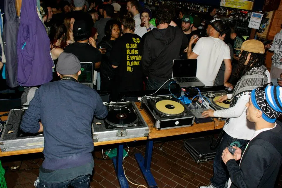 The DJ booth surrounded by dancers at the Frying Pan