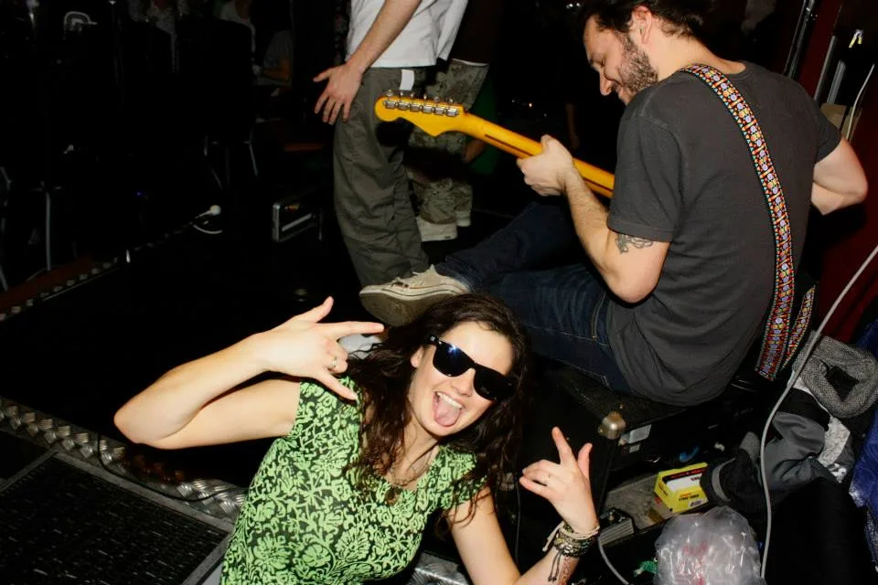 A guitarist playing a live set alongside the DJs at the snow jam