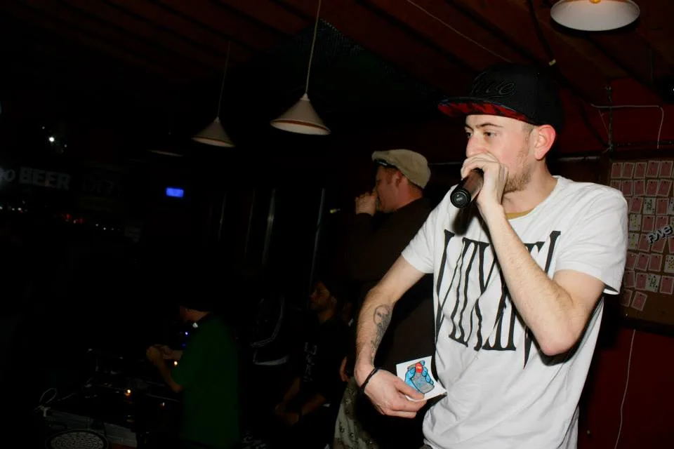 An MC on the microphone working the room at the snow jam