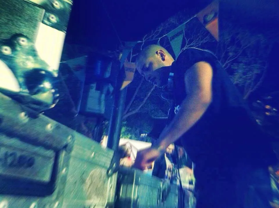 DJ CMAN playing at a street festival at night