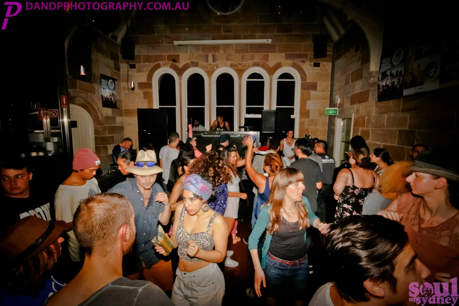Dancers filling the floor in front of the stage at the block party