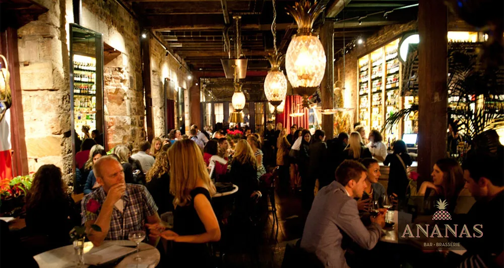 The dining room at Ananas Bar and Brasserie, arched brick and warm light