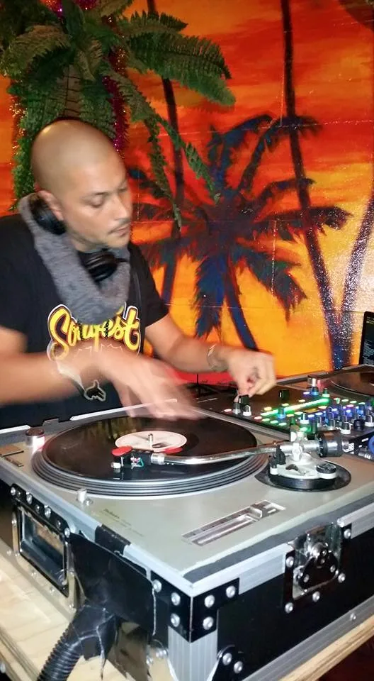A DJ mid-set in the booth during the Café Lounge Friday Sessions