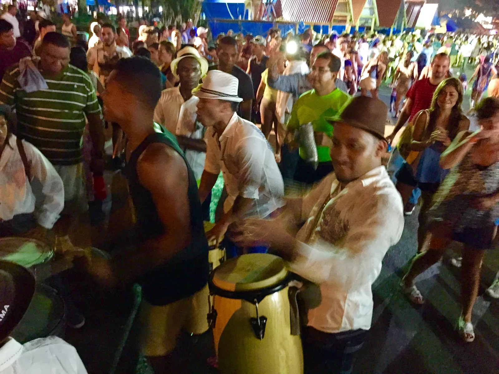 Drummers playing in the middle of a street celebration