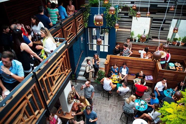 An outdoor courtyard crowd at Play Bar, Surry Hills