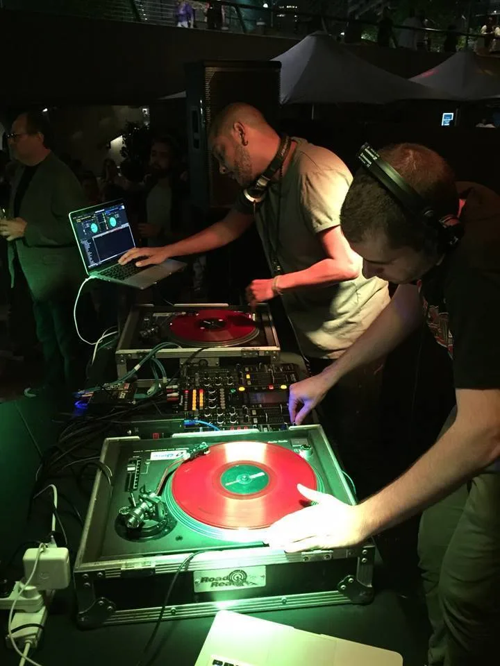 A DJ playing to an outdoor crowd at the Sounds of Afrobeats festival