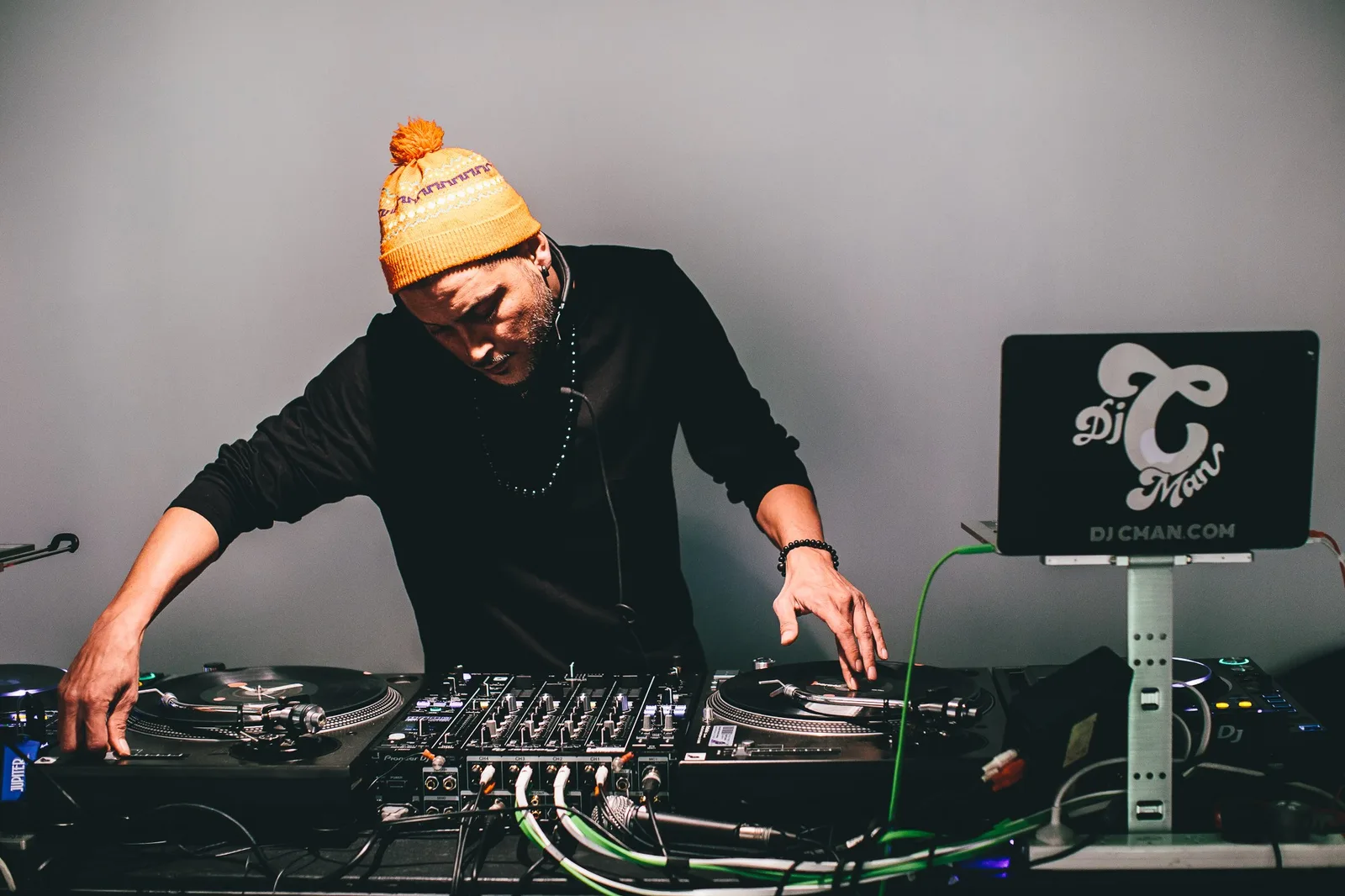 A DJ at the booth during the live art battle